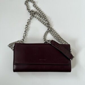 RUDSAK Elegant and Sleek Maroon Leather Crossbody with Silver Chain